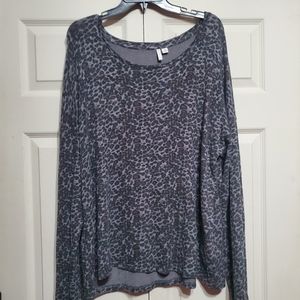 This is a leopard print on a smoky gray background blouse.